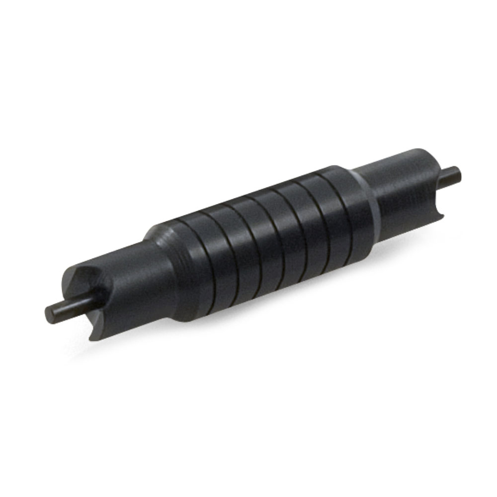 Screw machined valve component machined from steel and finished with Tru Temp mid-temperature Black Oxide